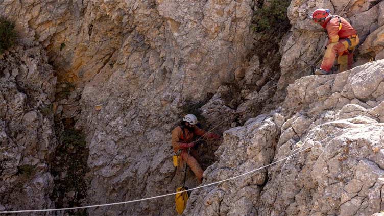 US caver who became trapped 1,000 metres deep in Turkey is moved halfway to surface