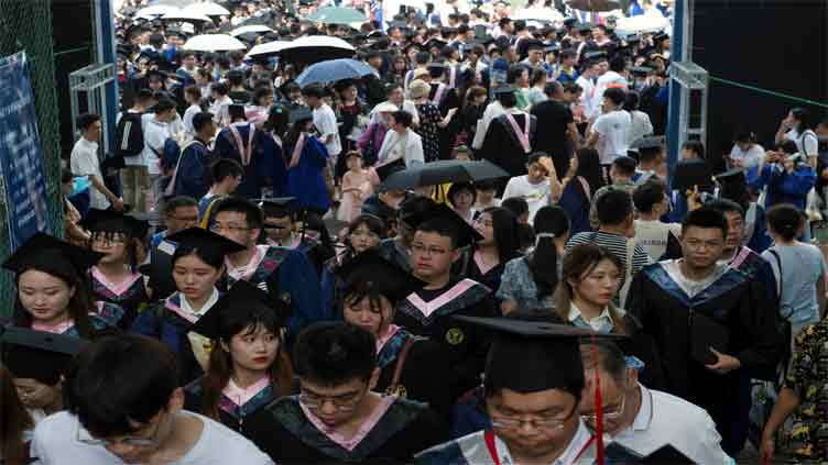 Record numbers sit for China civil service exam, hoping for job security amid high youth unemployment