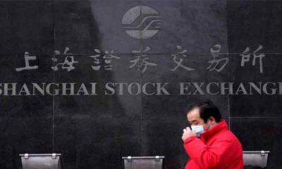 China stocks slump to near five-year low, Moody's changes outlook to negative