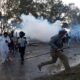 India security forces fire tear gas at protesting farmers on drive to Delhi