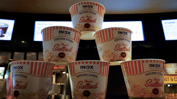 India's move to tax popcorn differently based on its sugar or spice content has drawn criticism from the opposition and sparked social media outrage, with two former government economic advisers questioning the tax system introduced in 2017. The Goods and Services Tax (GST) Council, chaired by the finance minister and including state representatives, announced on Saturday that non-branded popcorn mixed with salt and spices would attract a 5% GST, pre-packaged and branded popcorn 12%, and caramel popcorn, categorised as a sugar confectionery, 18%. The differential rates come into effect immediately, ending confusion over rates as popcorn was taxed differently across states. Explaining the rationale behind the decision to tax caramel popcorn at 18%, Finance Minister Nirmala Sitharaman said that any product with added sugar is taxed differently. The announcement, however, sparked a social media storm on Sunday, with opposition politicians, economists and supporters of Prime Minister Narendra Modi's government criticising the move and others creating memes and poking fun at it. "Complexity is a bureaucrat’s delight and citizens’ nightmare," India's previous Chief Economic Adviser K V Subramanian wrote on X. He questioned the rationale of the decision he said will contribute minimally to tax revenues, but inconvenience citizens. His predecessor, Arvind Subramanian, said "the folly is compounded because instead of at least moving in the direction of simplicity we are veering to greater complexity, difficulty of enforcement and just irrationality". One widely circulated post on X showed an image of a branded "salt caramel" popcorn packet and said how it would send the taxman into a tizzy calculating the tax rate on it. Jairam Ramesh, leader and spokesman of the main opposition Congress party, said the "absurdity of three different tax slabs for popcorn under GST ... only brings to light a deeper issue that the growing complexity of a system that was supposed to be a Good and Simple Tax". A finance ministry spokesperson, the GST Council Secretariat and a spokesman for the ruling Bharatiya Janata Party did not respond to requests for comment on the controversy. The GST system has run into similar controversies for its tax classifications in the past and faced questions although not on this scale. Previous controversies have involved taxing chapatis or unleavened Indian flatbread differently from layered flatbreads, different rates for curd and yogurt, and cream bun versus bun and cream served separately.