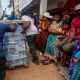 Angry residents of cyclone-hit Mayotte jeer Macron, plead for water