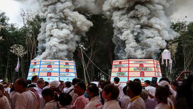 Thai ceremony for the dead brings good karma and emotional closure