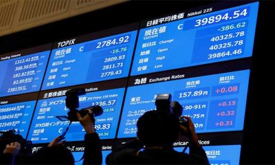 Shares muddled in Asia, Canadian dollar up on Trudeau reports